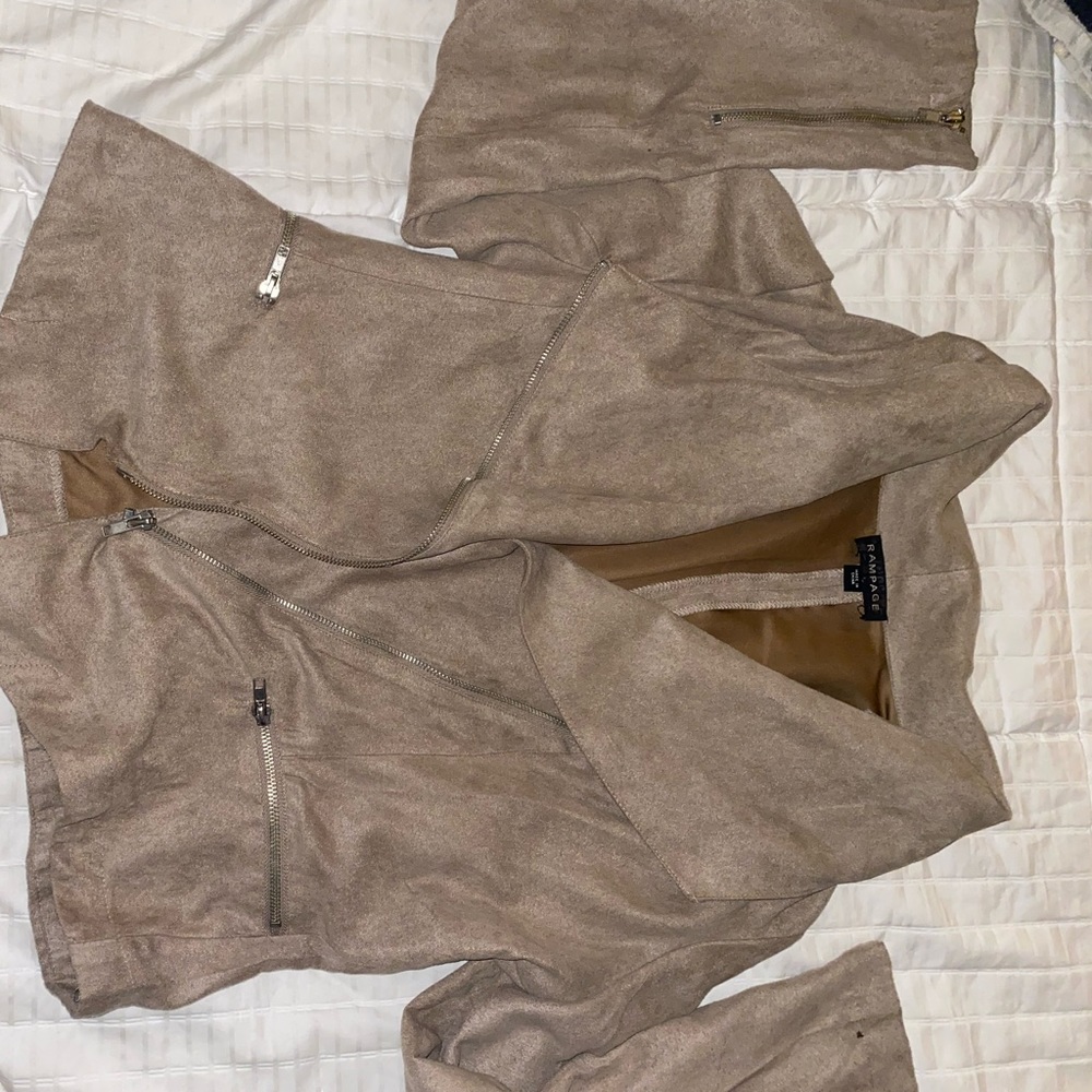 asymmetrical tan suede light jacket.